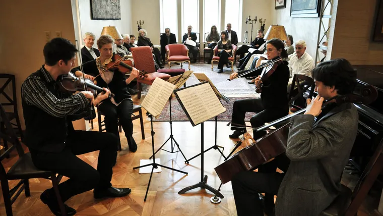ACE performing a house concert in the round